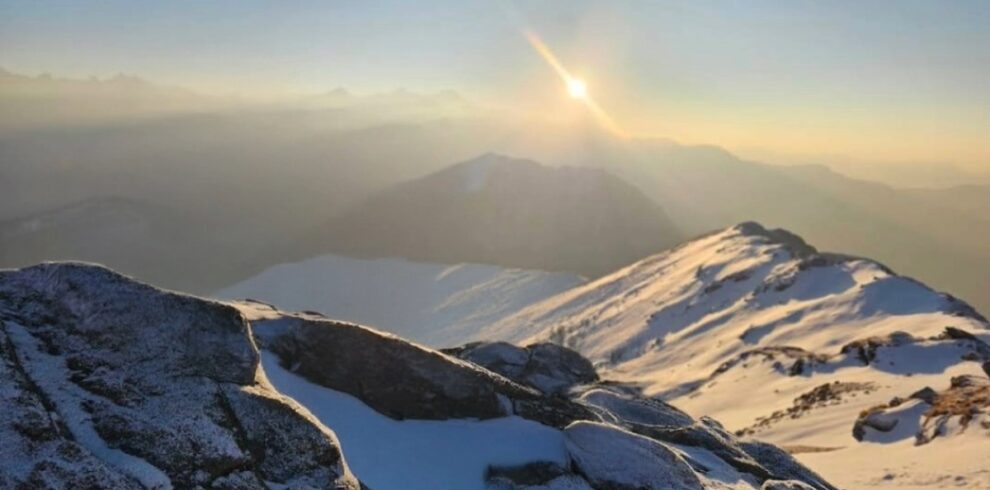 Kedarkantha summit sunrise view with snow covered Himalayan peaks in Uttarakhand