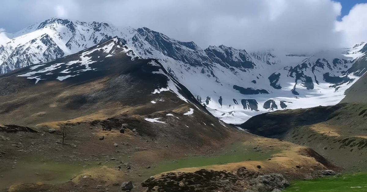 Kyarkoti Lake Trek Uttarakhand with pristine glacial lake and alpine meadow near Harsil Valley