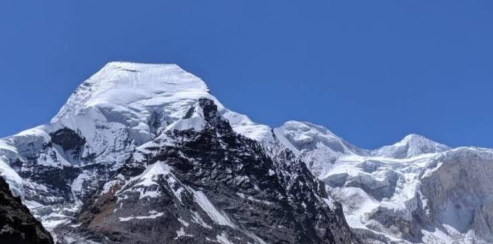 Satopanth Peak summit (7075m) in Garhwal Himalayas with snow-covered ridge and technical climbing route