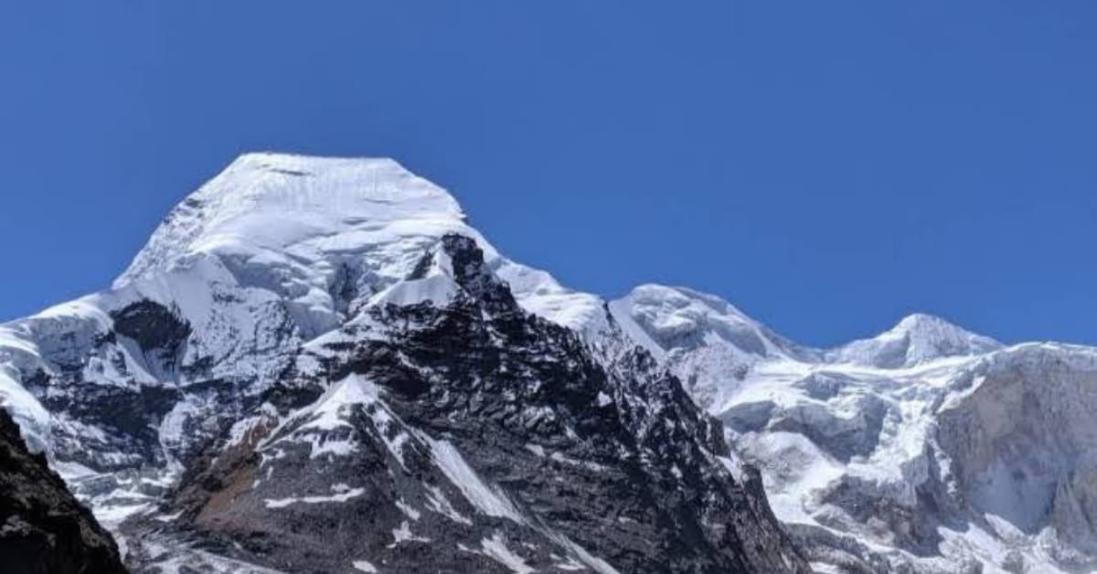 Satopanth Peak summit (7075m) in Garhwal Himalayas with snow-covered ridge and technical climbing route