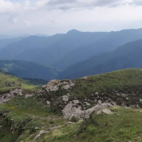 Vijay Top Trek summit view at 3800 meters with Himalayan mountain ranges in Uttarakhand