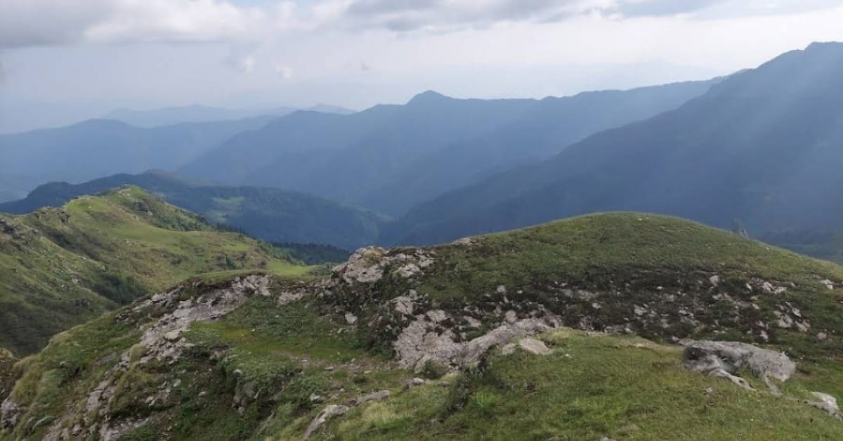 Vijay Top Trek summit view at 3800 meters with Himalayan mountain ranges in Uttarakhand